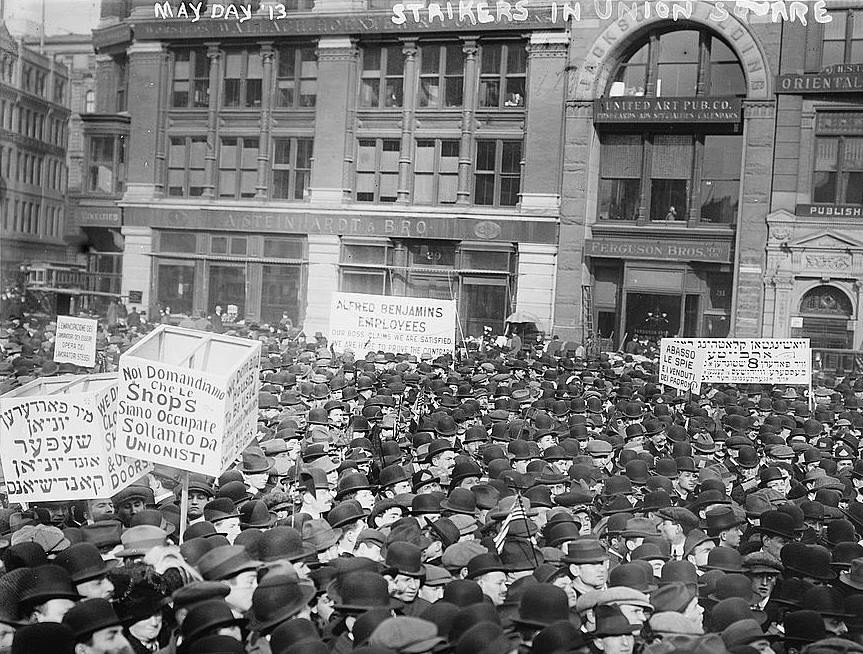 Demonstrators in New York City during the 1913 May Day parade. Signs feature Yiddish, Italian, and English. Photo via Library of Congress.